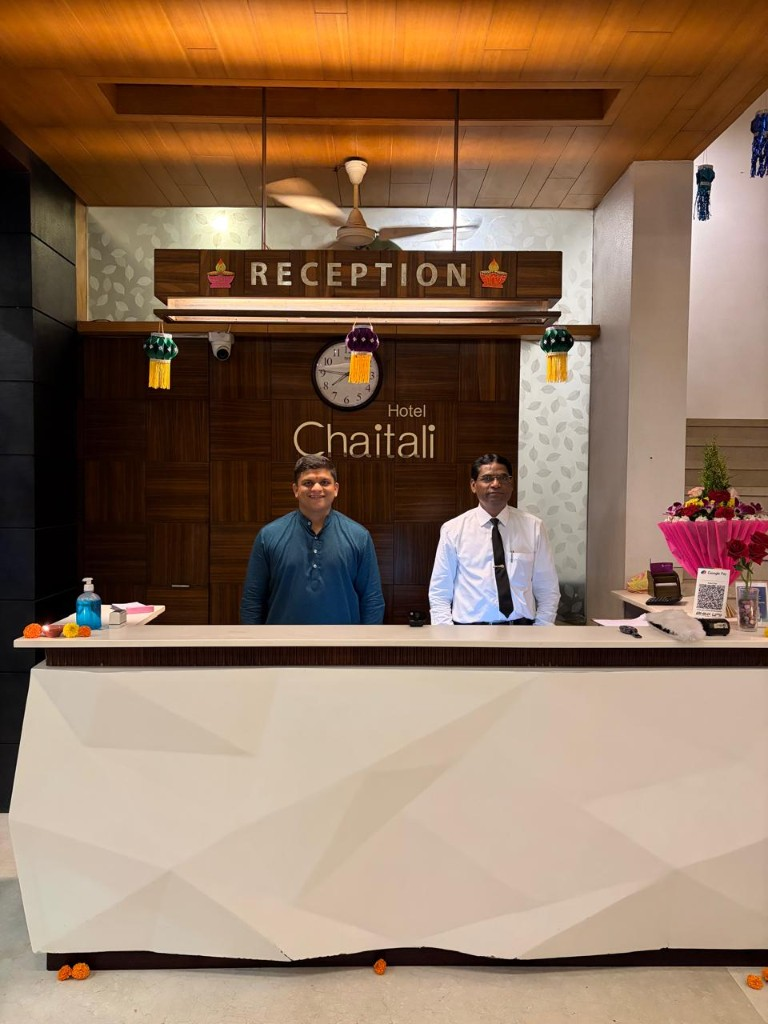 Hotel Chaitali reception team at the front desk in Kolhapur